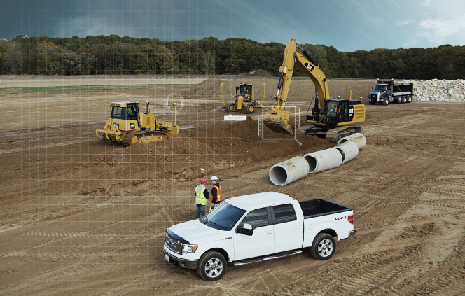 2 men on a worksite, standing by a car and heavy machinery in the background